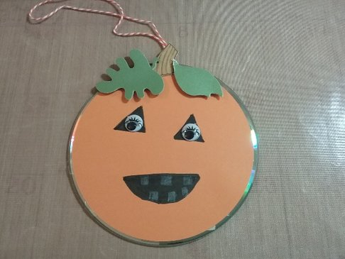 Learn to make a pumpkin CD craft at the Highland Library.