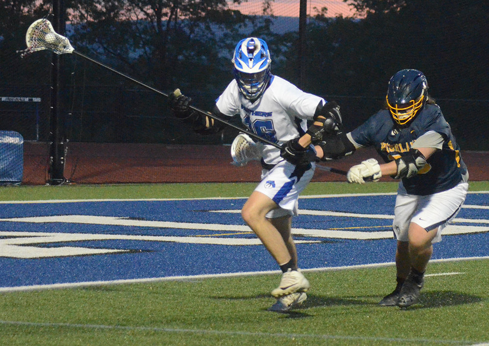Wallkill’s Tyler Jaffee plays the ball around the back.