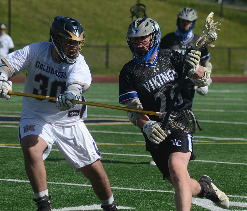 Valley Central’s Dan Latimer brings the ball forward as Newburgh’s Ryan Russo defends during Friday’s boys’ lacrosse game at Academy Field in Newburgh.