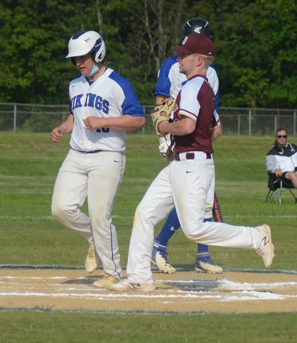 Valley Central’s Joshua Miller scored a run as O’Neill’s Jackson Waugh covers the plate.