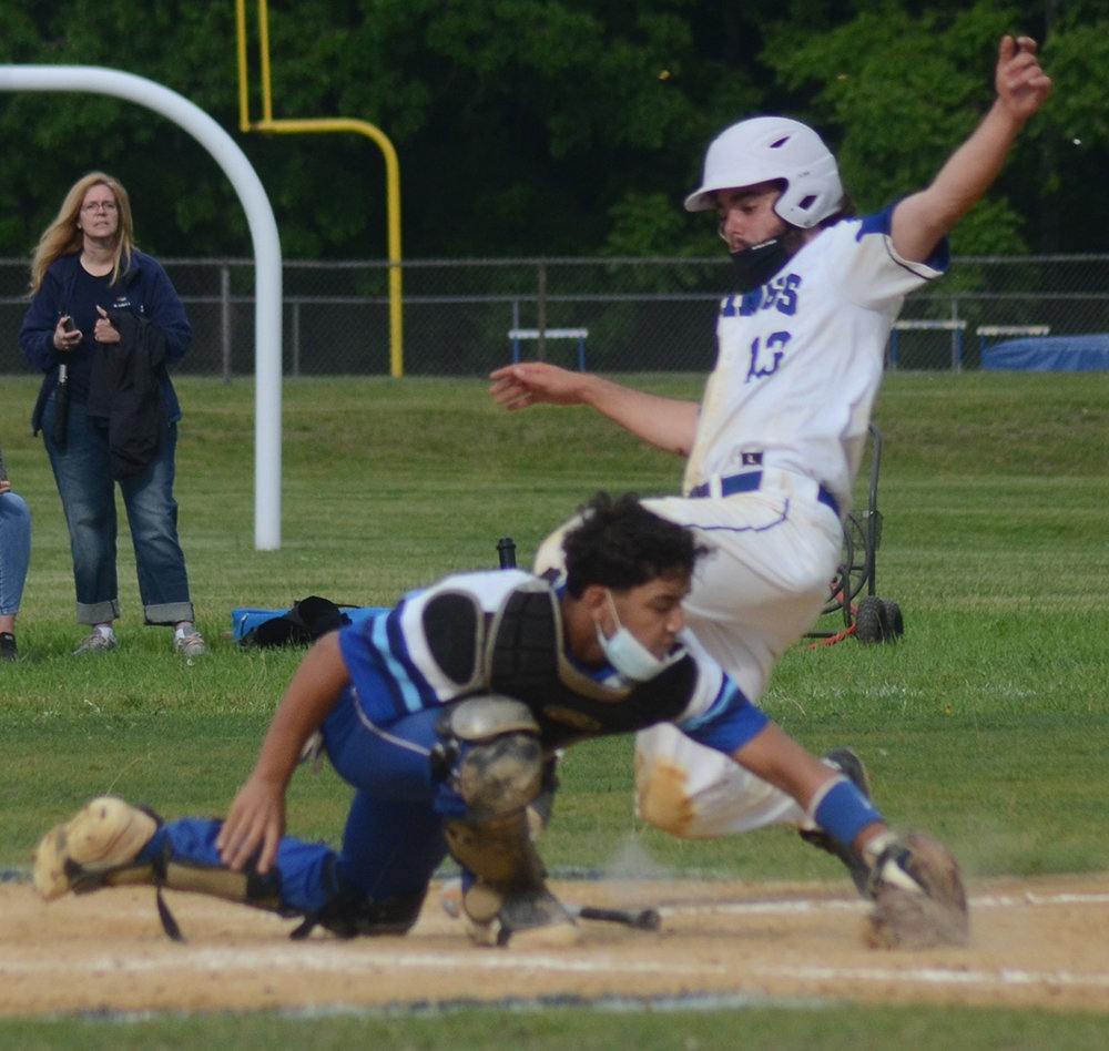 Valley Central’s Matthew McDonald slides into home plate as Wallkill catcher Allen Mirabal takes the throw during Wednesday’s non-league baseball game at Valley Central High School in Montgomery.