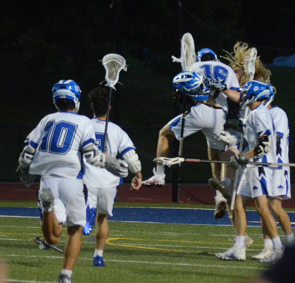 The Wallkill boys’ lacrosse team celebrates winning the Section 9 Class C boys’ lacrosse championship on Friday at Wallkill High School.