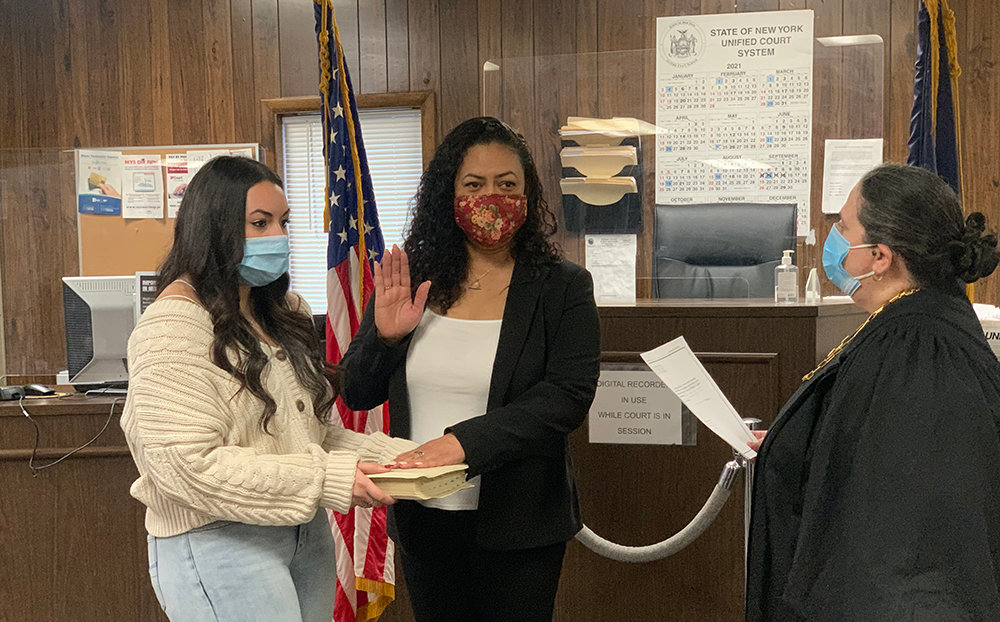 Plattekill Town Justice Annamaria Maciocia swears in new Supervisor Jennifer Salemo (center) accompanied by her daughter Taylor.