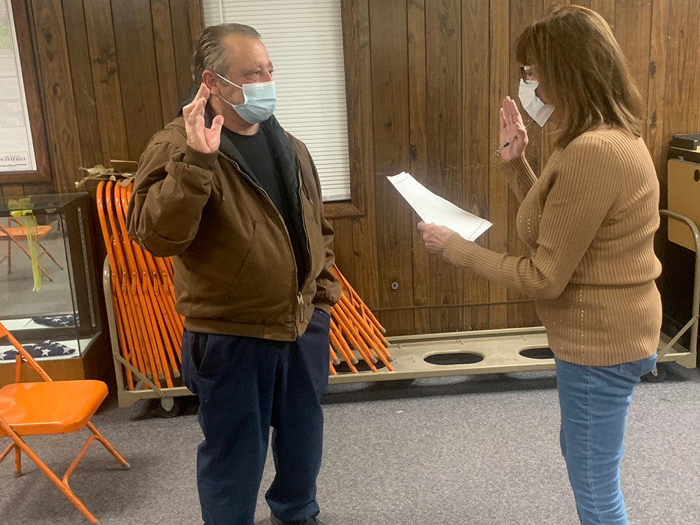 James Fazio is sworn in as a new member of the Town of Plattekill’s Zoning Board of Appeals by Town Clerk Donna Hedrick.