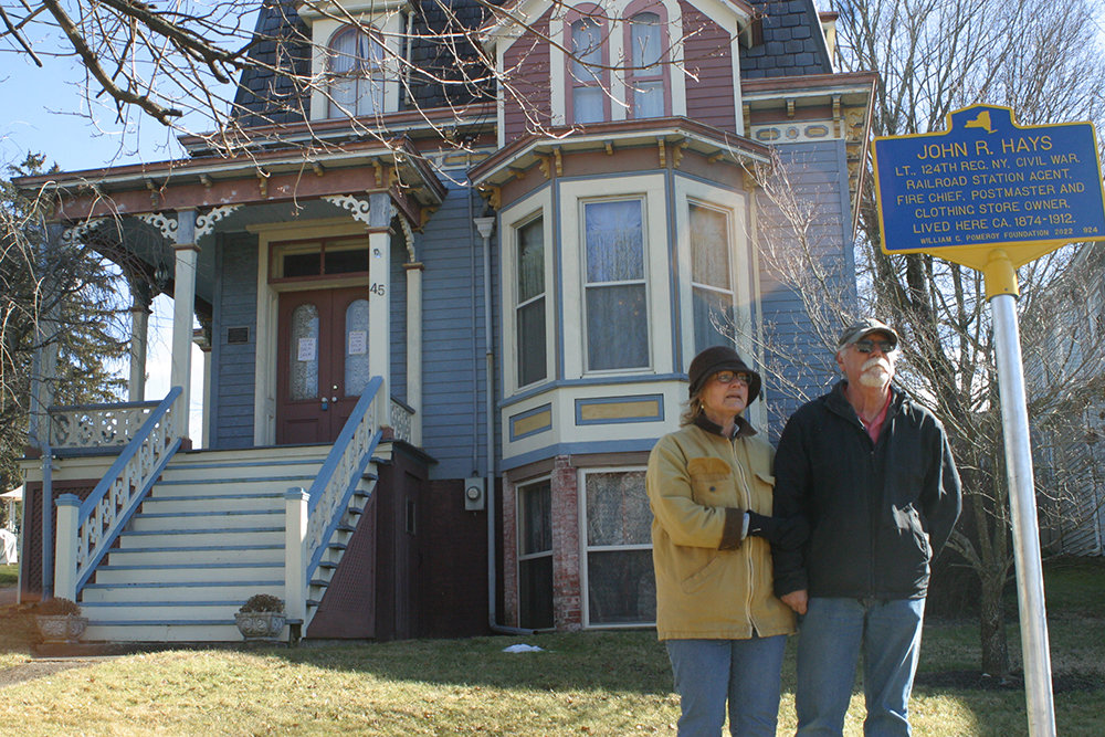 Nancy and Dave Ohlmer, outside their Maple Street home last Friday, when a historic marker, honoring its builder, John R. Hays, was dedicated.