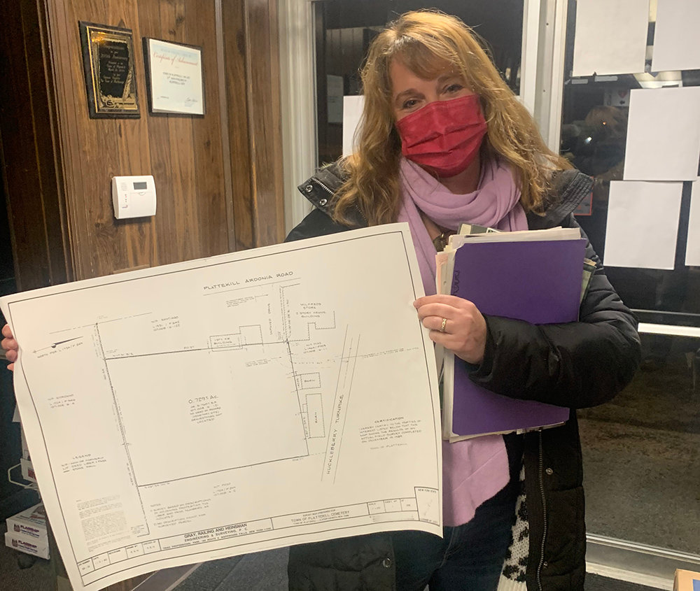 Plattekill town historian Libby Werlau shows a map of the property where a controversial gas station and convenient store is proposed in Plattekill. She appeared before the Town Zoning Board of Appeals to discuss her concerns about the project that borders a town cemetery.