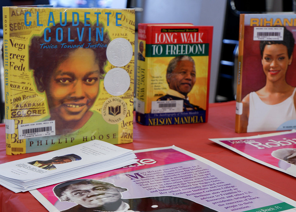 Books and posters of black leaders, showing the importance of black culture.