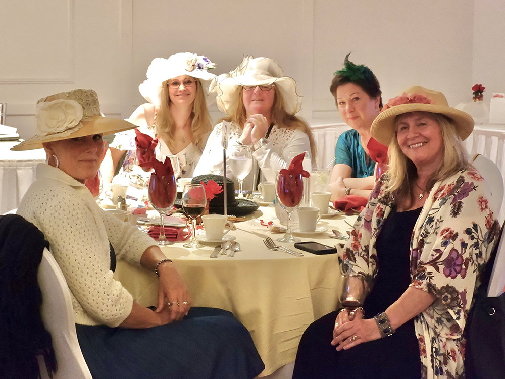 A table showing off their extravagant hats.