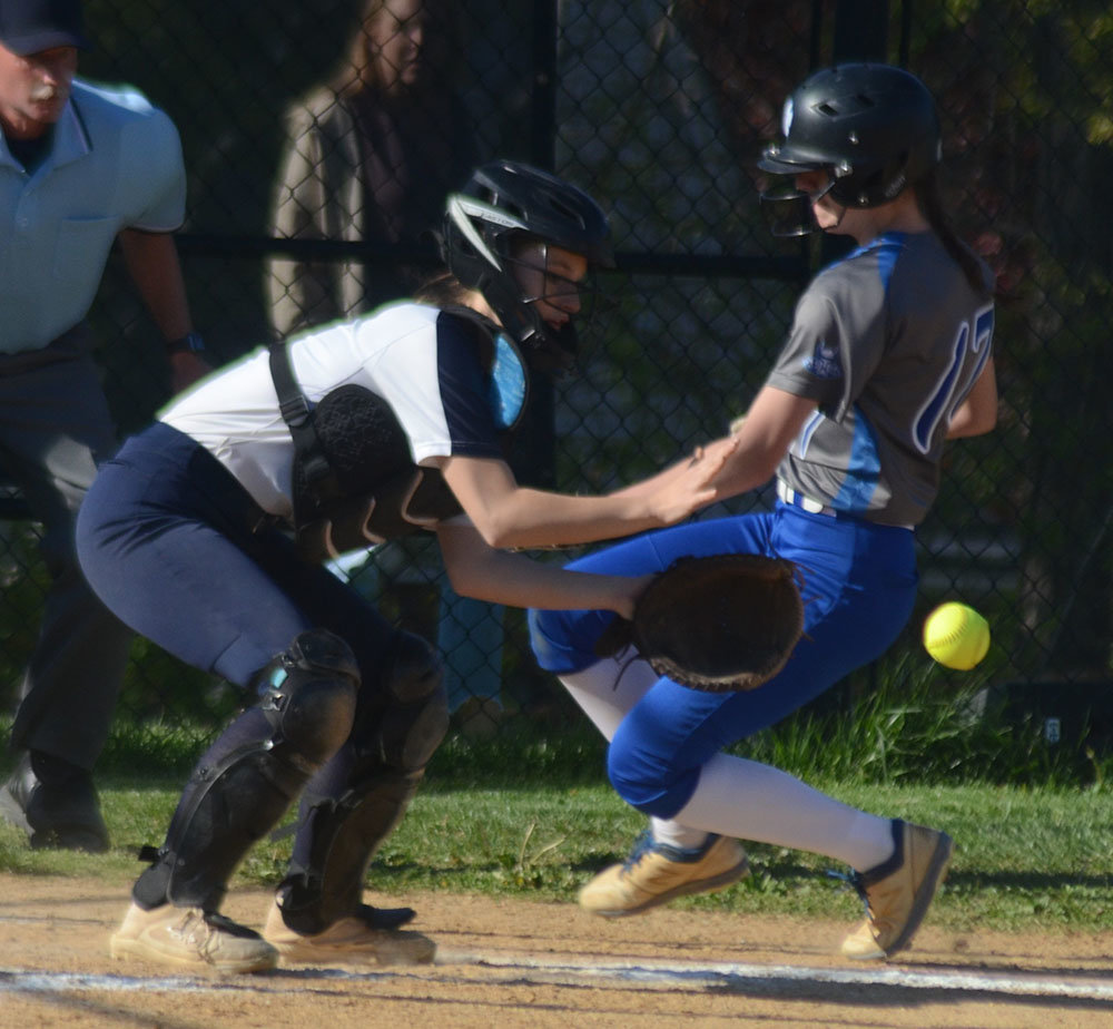 Valley Central’s Brianna Robinson slides into home plate as Newburgh catcher Melissa Schulze waits for the throw.