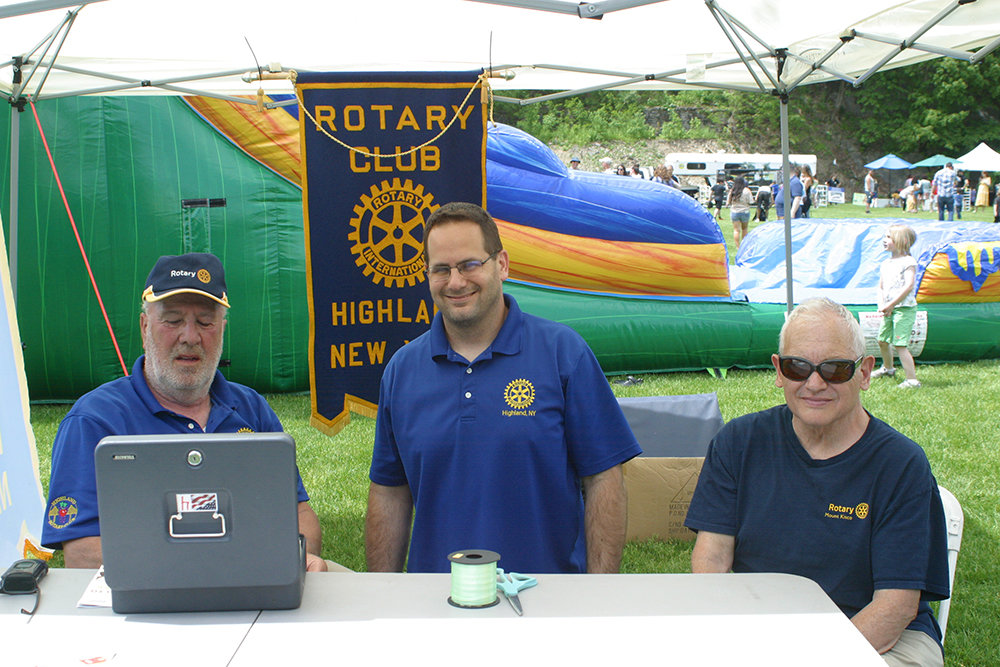 Rotarians (l. – r.) Sal Sovella, Dave Lambert  and Bruce  Desmond sold tickets to the bounce houses.