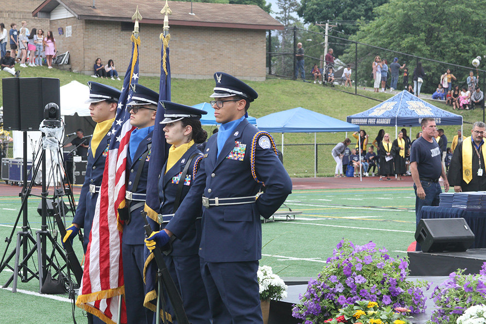 The Junior ROTC Color Guard stands at attention.