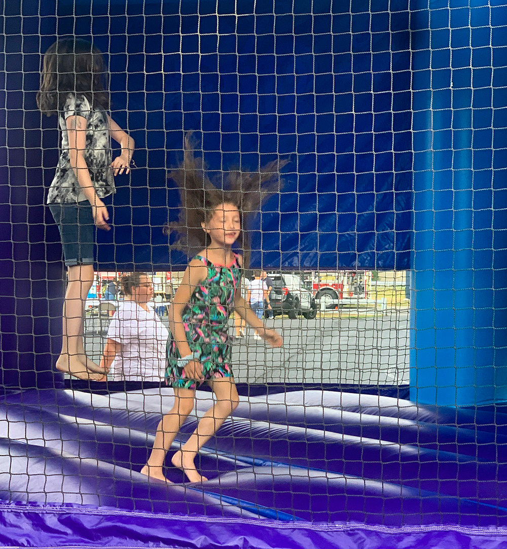 Kids having fun at the bounce house.