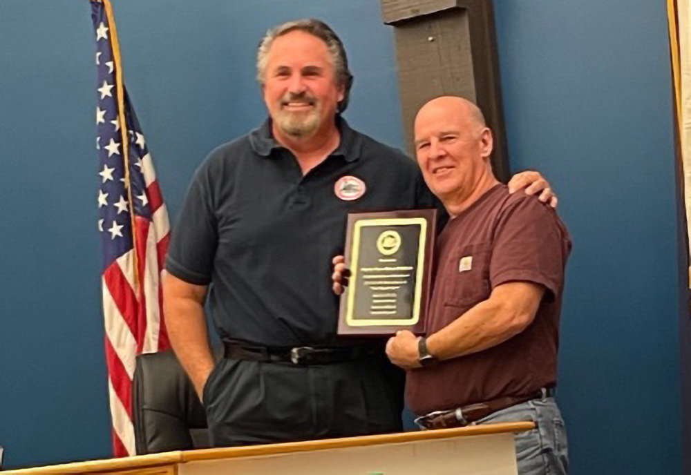 Maybrook Mayor Dennis Leahy (l.) presents Deputy Mayor Robert Pritchard (r.) with a plaque from the Village Board at last week’s  meeting in appreciation for his many years of service to the village.
