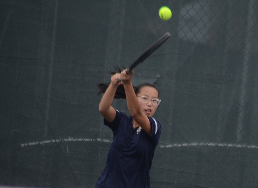 Highland’s Lena Tran returns the ball during the MHAL girls’ tennis tournament on Oct. 13, 2021, at FDR High School in Hyde Park.