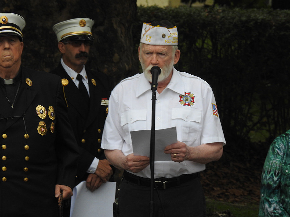 Dave McTamaney read aloud the names of local residents who died on Sept. 11, 2001.