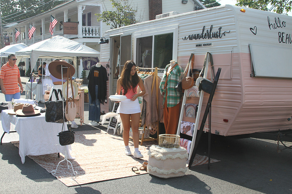 A sidewalk boutique provided its own changing room.