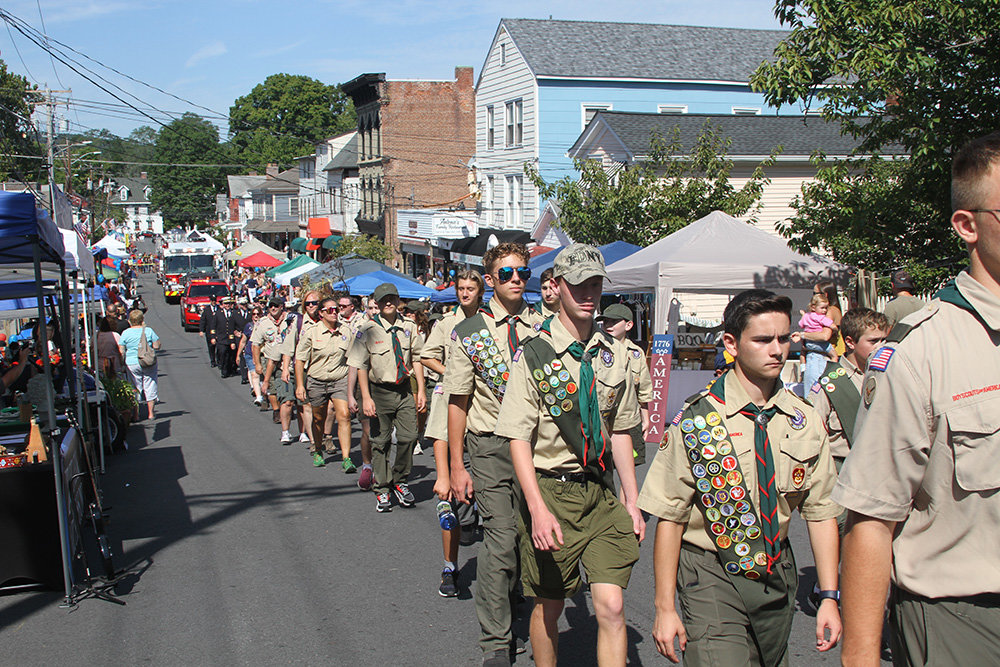 Scouts marched uphill on Clinton Street.