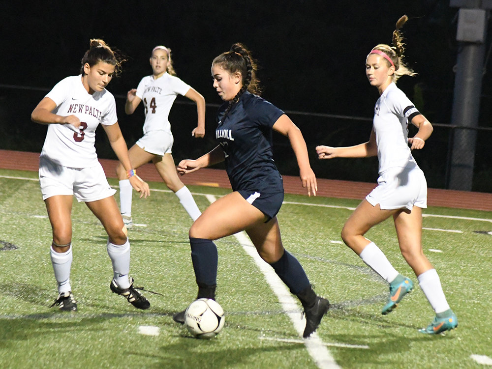 Wallkill’s Lainey Flanagan dribbles the ball down the field as New Paltz’ Maggie DiDonna (3) and Soleil Miller (6) defend and New Paltz’ Kalle Masseo looks on during Thursday’s MHAL girls’ soccer game at Wallkill Senior High School.
