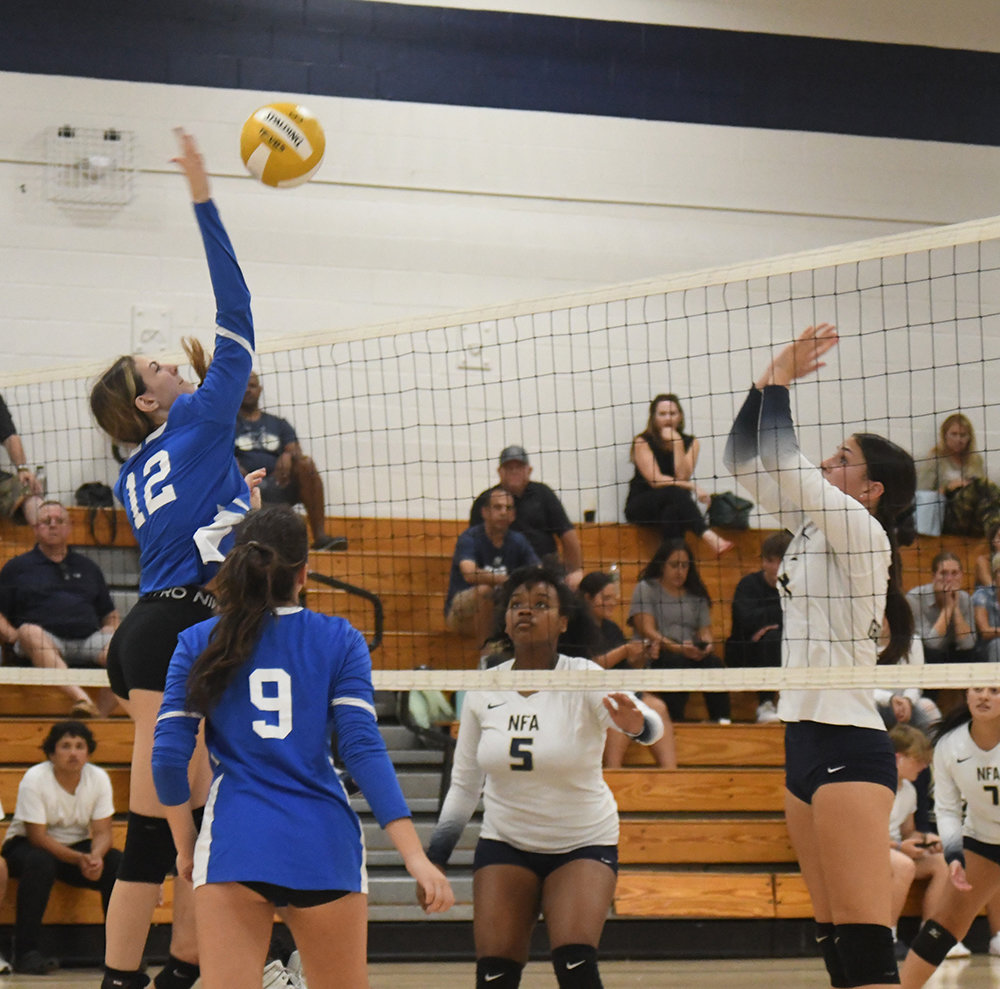 Valley Central’s Maggie Bishopp sends the ball over the net as Newburgh’s Augstina White defends and Valley Central’s Abby Rieber looks on during Wednesday’s OCIAA crossover volleyball match at Newburgh Free Academy.