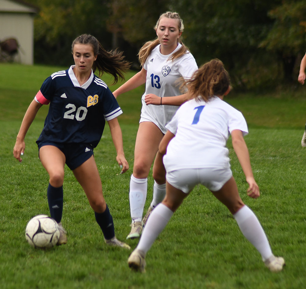 Pine Bush’s Morgan Tubbs plays the ball down the field as Valley Central’s Kelly Schmidt (1) and Julia Capicchioni defend during Friday’s OCIAA Division II girls’ soccer game at Pine Bush Elementary School.
