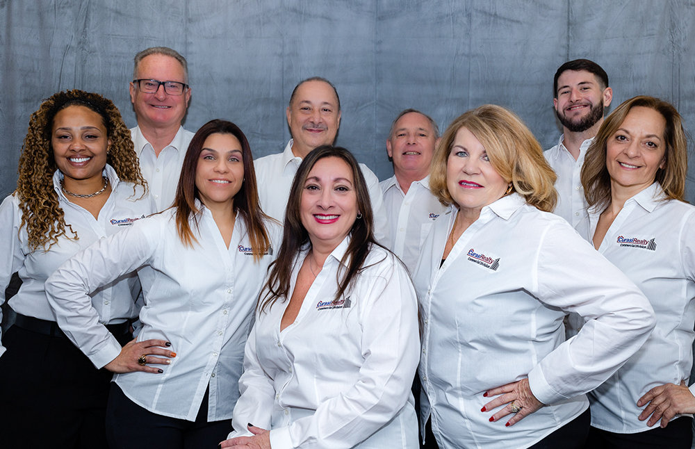 Back Row (from left to right): Neal Kolze, Cesar Landestoy, Jeffrey Lyons, Lucas Irace. Front Row (from left to right): Marie Savage, Carol Cruz, AnnMarie O’Brien, Pamela DiMartino, Wendy Reinike.