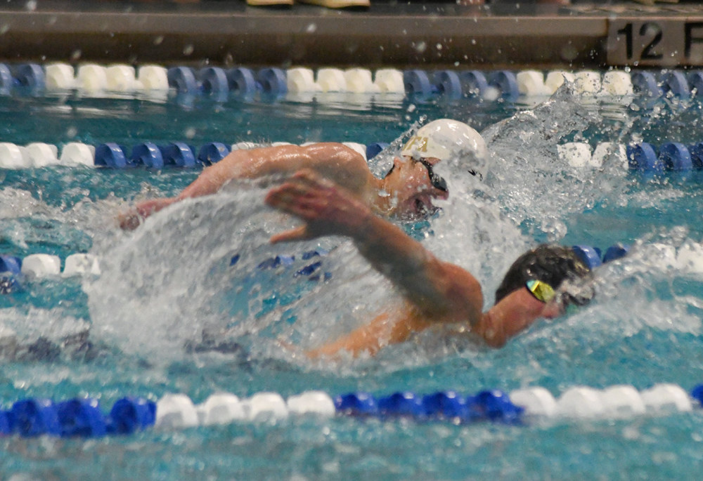 Newburgh's Jack Mummery races Valley Central's Timothy Grabinski in the 200-yard freestyle during Saturday's Section 9 boys' swimming championship meet at Valley Central High School in Montgomery.