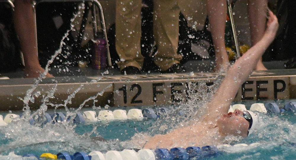 Pine Bush's Liam Gallagher swims the 10-yard backstroke during Saturday's Section 9 boys' swimming championship meet at Valley Central High School in Montgomery.