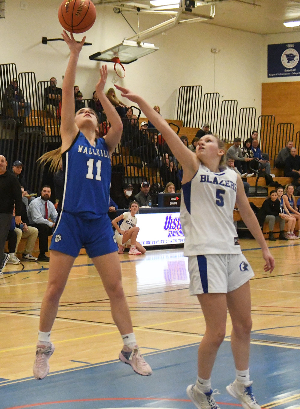 Wallkill's Zoe Mesuch shoots over Millbrook's Beth Bosan during Thursday's MHAL championship girls' basketball game at SUNY Ulster in Stone Ridge.