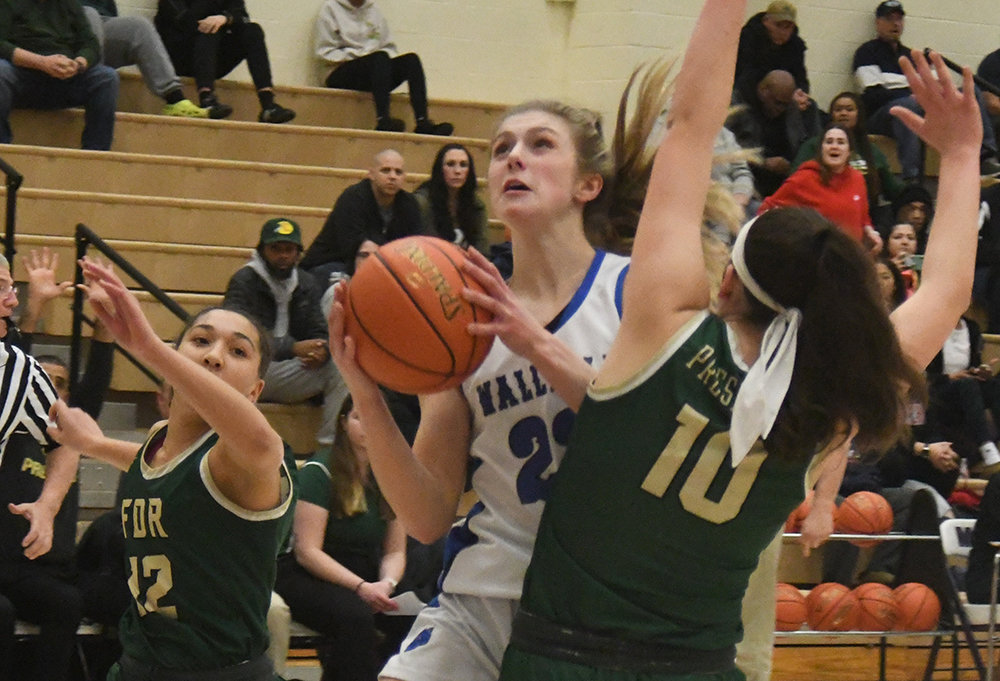 Wallkill's Emma Spindler goes up for a basket as FDR's Erin Drickel (10) defends and Yadi Smith looks on during Saturday's Section 9 Class A championship girls' basketball game at Monroe-Woodbury High School in Central Valley.