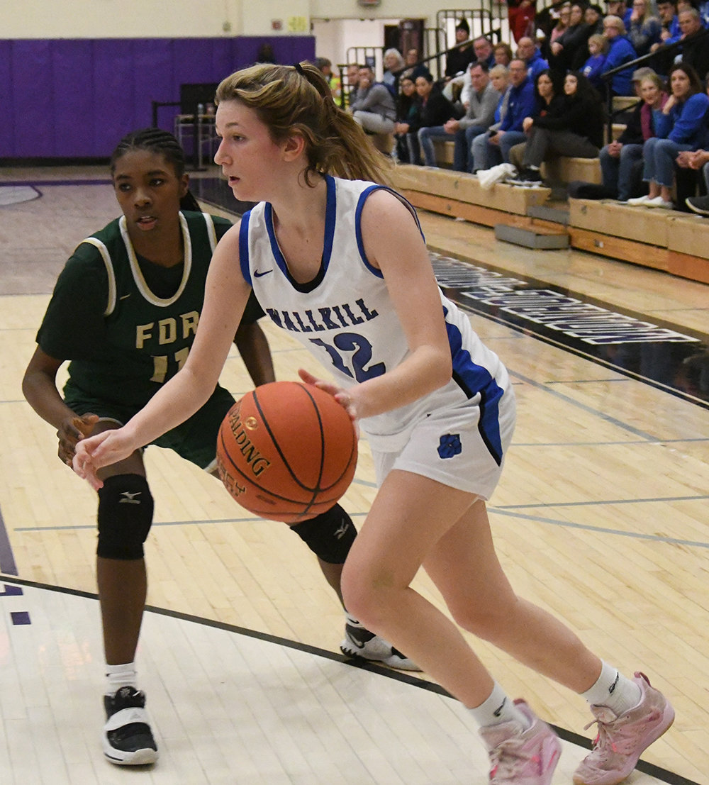 Wallkill's Alex Dembinsky drives past FDR's Asyra King during Saturday's Section 9 Class A championship girls' basketball game at Monroe-Woodbury High School in Central Valley.
