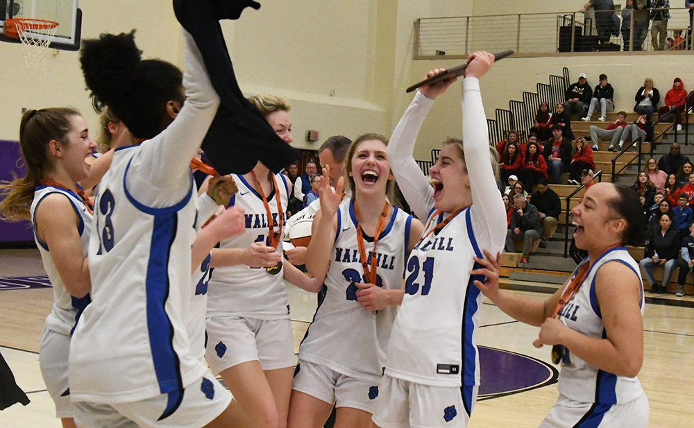 Wallkill's Grace Mesuch holds up the Section 9 championship plaque after the Panthers' victory over the FDR Presidents on Saturday at Monroe-Woodbury High School in Central Valley.