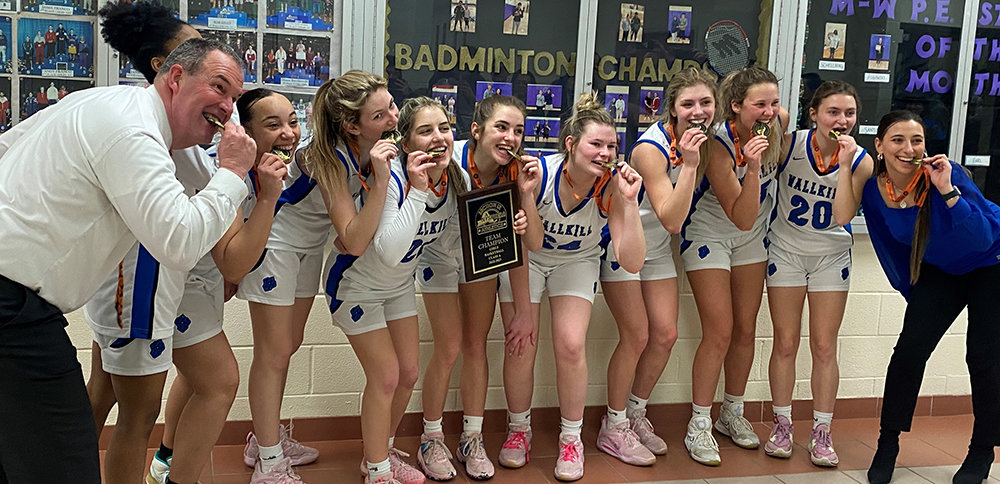 The Wallkill girls' basketball team poses with their medals after winning the Section 9 Class A championship over the FDR Presidents at Monroe-Woodbury High School in Central Valley.