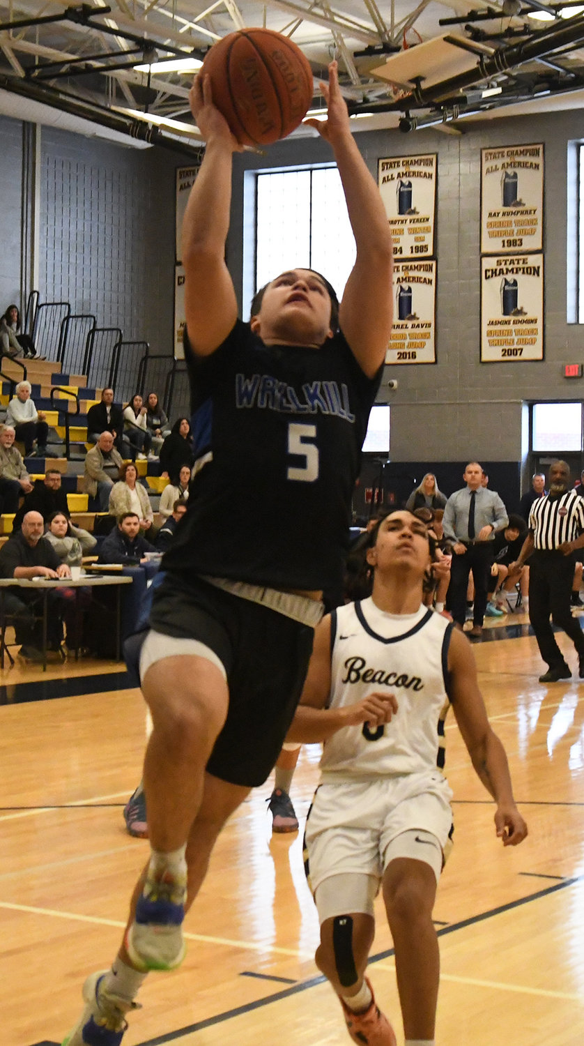 Wallkill's Mason Ondreyko goes up for a shot as Beacon's Adrian Beato trails the play during a Section 9 Class A quarterfinal boys' basketball game on Feb. 27 at Beacon High School.