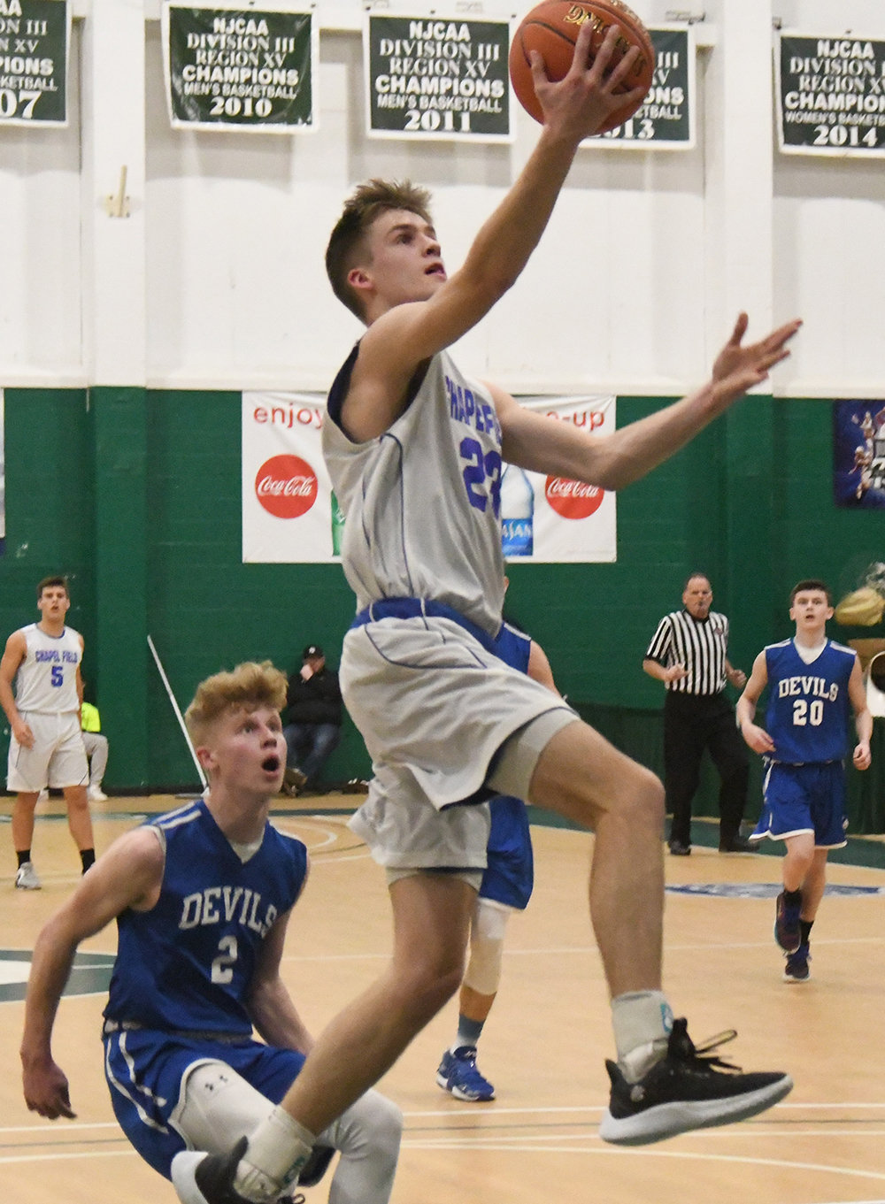 Chapel Field's Noah Swart goes up for a basket as Roscoe's Aiden Johnston trails the play during Wednesday's Section 9 Class D championship boys' basketball game at SUNY Sullivan in Loch Sheldrake.