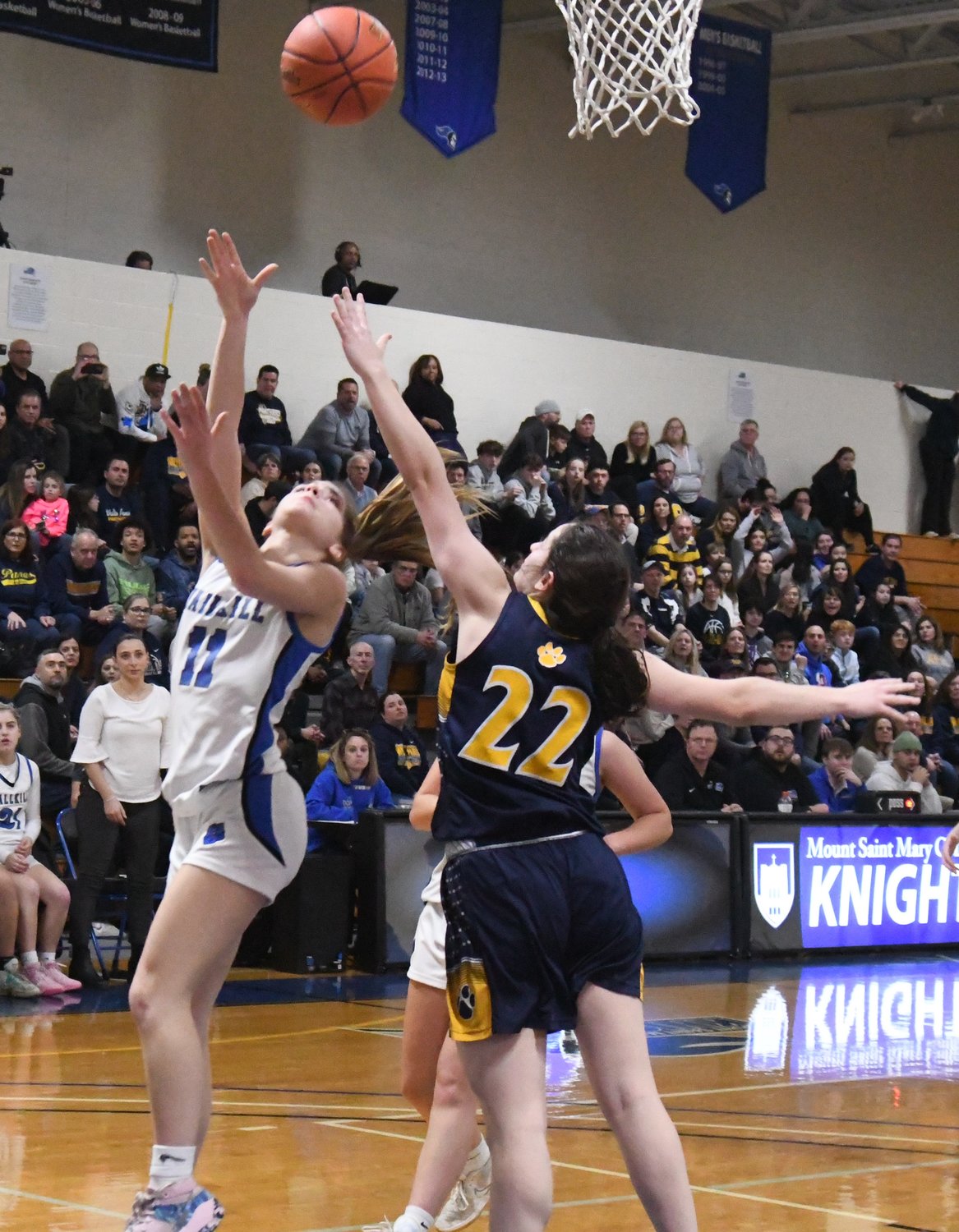 Wallkill's Zoe Mesuch puts up a shot as Walter Panas' Julia Gallinger defends during Saturday's NYSPHSAA Class A regional final at Mount Saint Mary College in Newburgh.