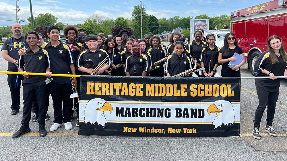 The Heritage Middle School Marching Band prepares to perform in the parade.