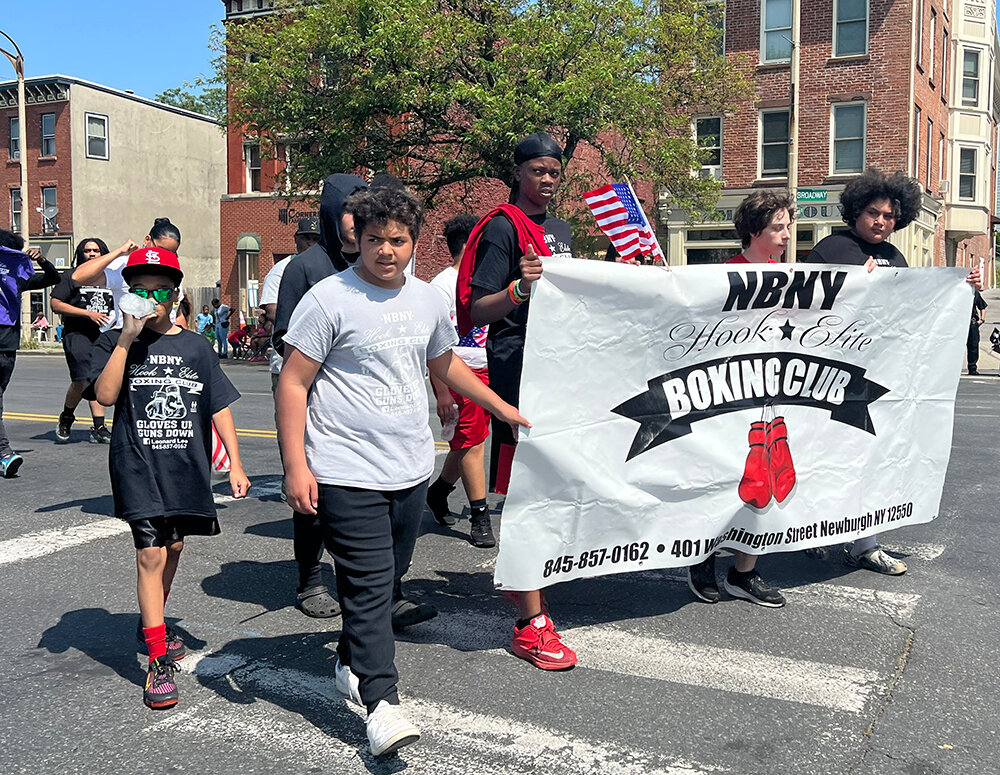 Newburgh Hook Elite Boxing Club fighters walk along Liberty Street celebrating Memorial Day.