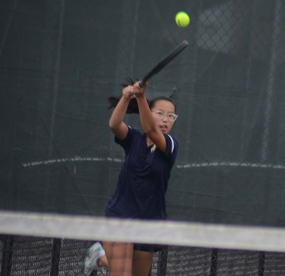Highland's Lena Tran returns the ball during the MHAL girls' tennis tournament on Oct. 13, 2021, at FDR High School in Hyde Park.