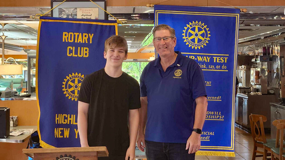 Highland High School junior Gunnar Smith (left) poses with Highland Rotary Club President Steve Laubach.