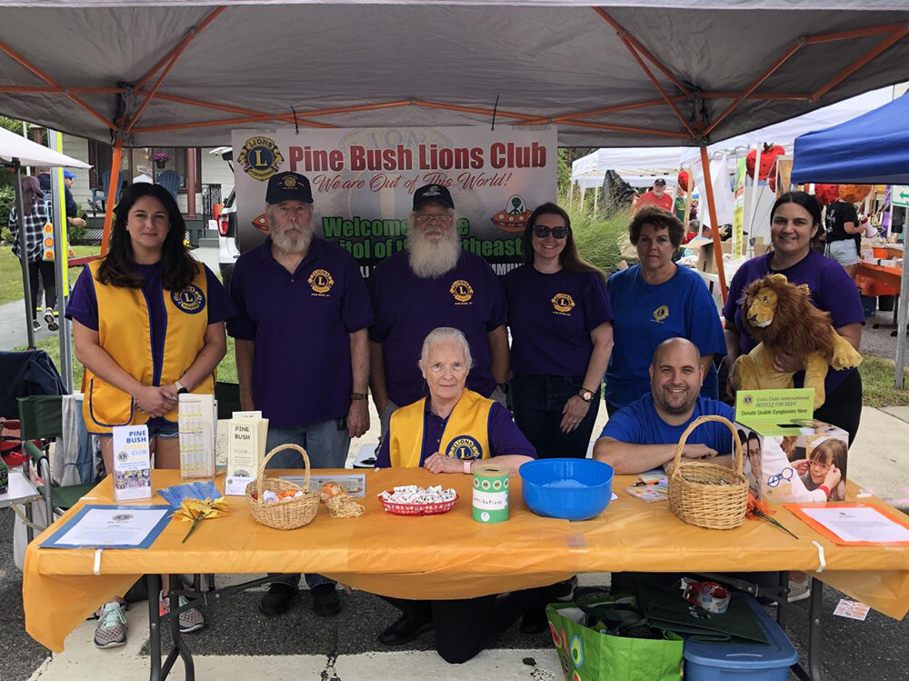 Sue Wiand and members of Pine Bush Lions Club at their booth.